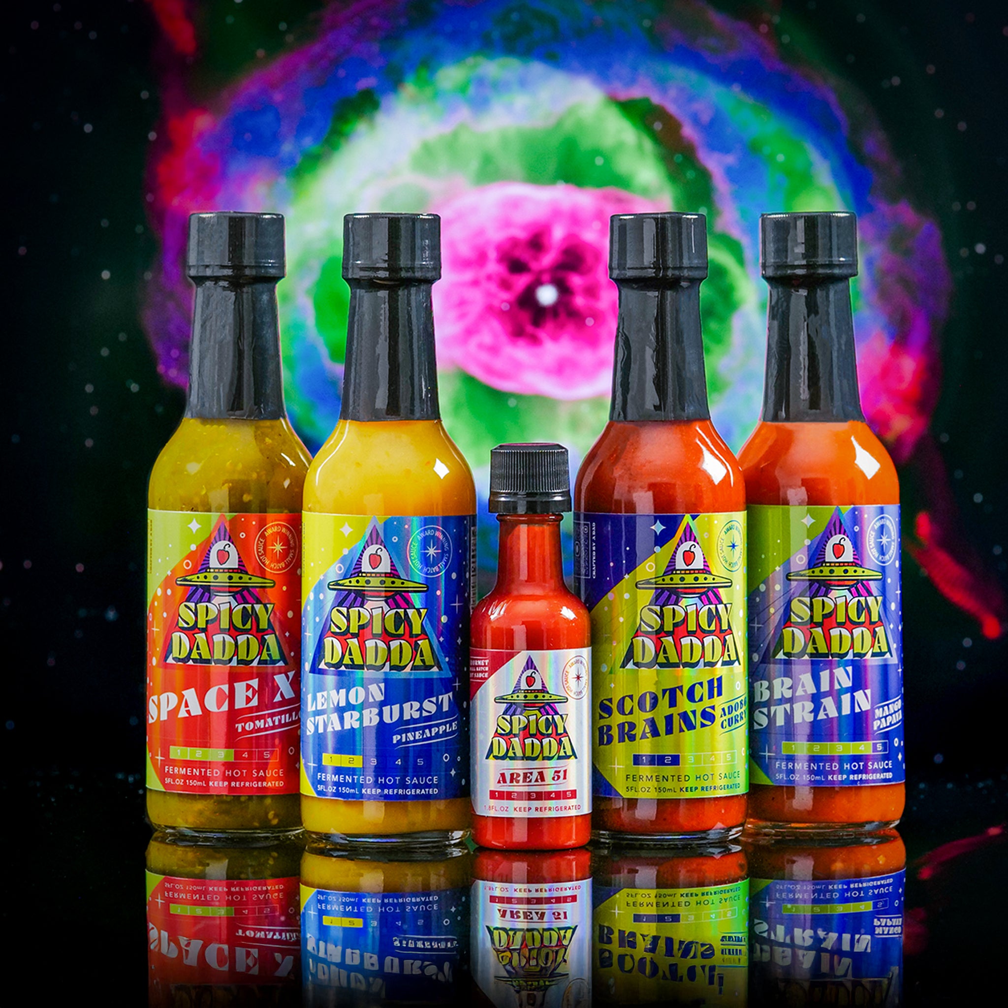 The Spicy Dadda First Contact bundle featuring our five signature flavors of homegrown fermented hot sauce against a surreal cosmic space background.